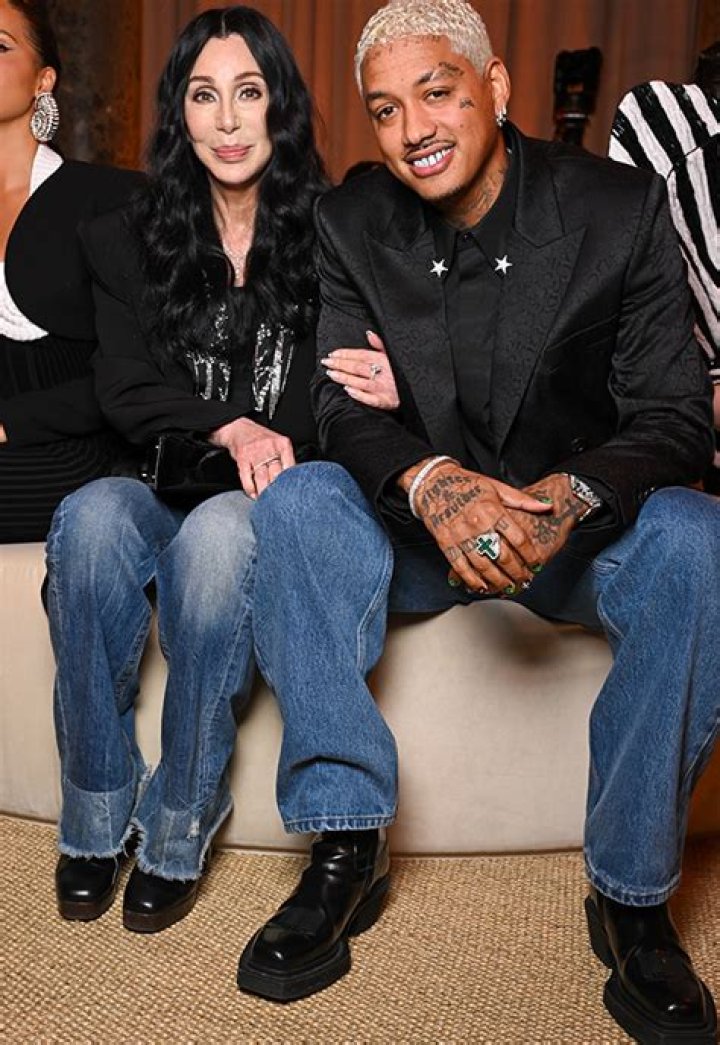 Cher, 77, Cuddles Up to Boyfriend A.E. Edwards, 38, During Rare Appearance at Paris Fashion Week: Photos