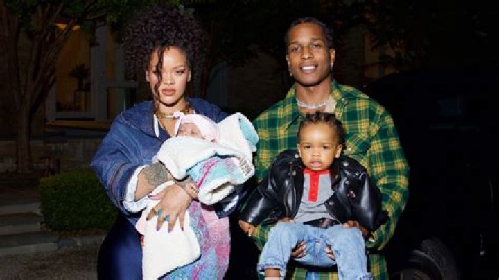 Rihanna Celebrates Pride Wearing Just A T-Shirt & Rainbow Stockings In Sultry Bedroom Photo Shoot
